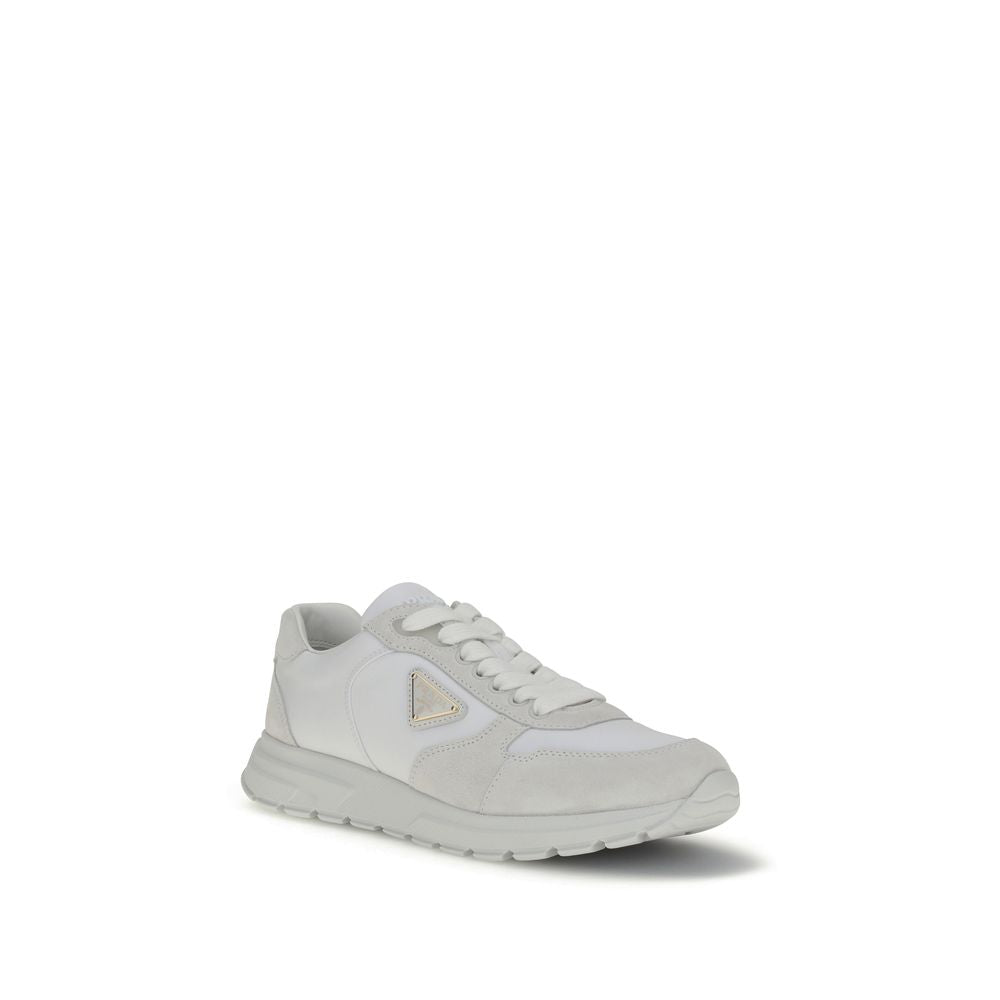 White Recycled Polyamide Athletic SneakersPrada’s Prax 2.0 Sneakers combine Re-Nylon and suede in a contemporary and elegant design. Featuring cotton lace-up fastening, they are embellished with the classic enameled metal triangle logo, the distinctive sy