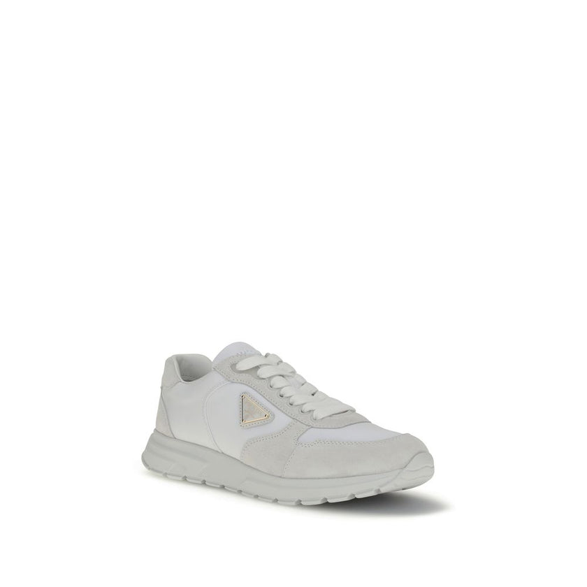 White Recycled Polyamide Athletic SneakersPrada’s Prax 2.0 Sneakers combine Re-Nylon and suede in a contemporary and elegant design. Featuring cotton lace-up fastening, they are embellished with the classic enameled metal triangle logo, the distinctive sy