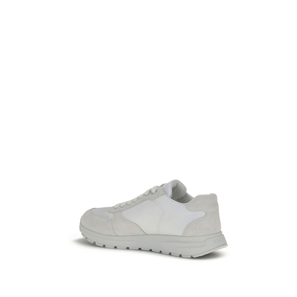 White Recycled Polyamide Athletic SneakersPrada’s Prax 2.0 Sneakers combine Re-Nylon and suede in a contemporary and elegant design. Featuring cotton lace-up fastening, they are embellished with the classic enameled metal triangle logo, the distinctive sy