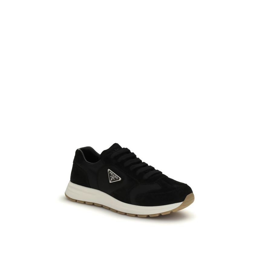 Black Recycled Polyamide Athletic SneakersPrax 01 re-nylon Sneakers by Prada blend contemporary aesthetics and innovative materials. The upper with nylon lace loops lends a technical, modern look, enhanced by the enameled metal triangle logo and screen-pr