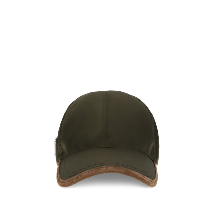 Green Recycled Polyamide Cap (Baseball Hat)Prada’s re-nylon Baseball Hat is an accessory with a sporty and sophisticated style. Made of Re-Nylon with contrasting suede inserts, it is embellished with the iconic metal logo triangle on the side. Complete wi
