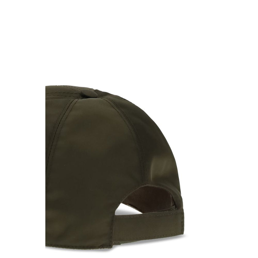 Green Recycled Polyamide Cap (Baseball Hat)Prada’s re-nylon Baseball Hat is an accessory with a sporty and sophisticated style. Made of Re-Nylon with contrasting suede inserts, it is embellished with the iconic metal logo triangle on the side. Complete wi