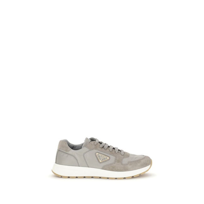 Gray Recycled Polyamide Athletic SneakersPrax 01 re-nylon Sneakers by Prada blend contemporary aesthetics and innovative materials. The upper with nylon lace loops lends a technical, modern look, enhanced by the enameled metal triangle logo and screen-pri