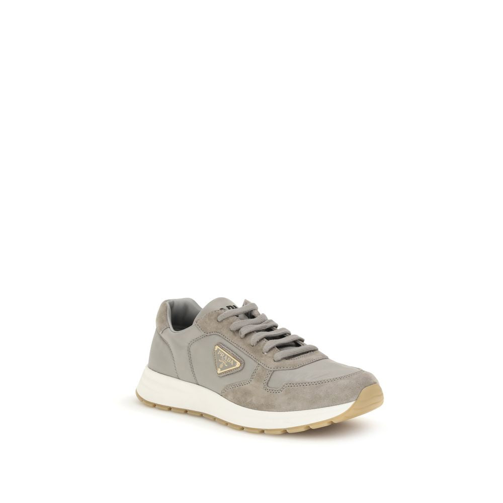 Gray Recycled Polyamide Athletic SneakersPrax 01 re-nylon Sneakers by Prada blend contemporary aesthetics and innovative materials. The upper with nylon lace loops lends a technical, modern look, enhanced by the enameled metal triangle logo and screen-pri