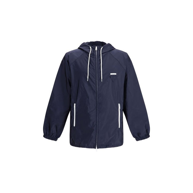 Blue Recycled Polyamide Shell JacketPrada’s Re-Nylon Jacket is a functional and refined garment designed for modern, sustainable elegance. Featuring an adjustable hood with drawstring and front closure with a double-slider zipper, it has two side welt poc
