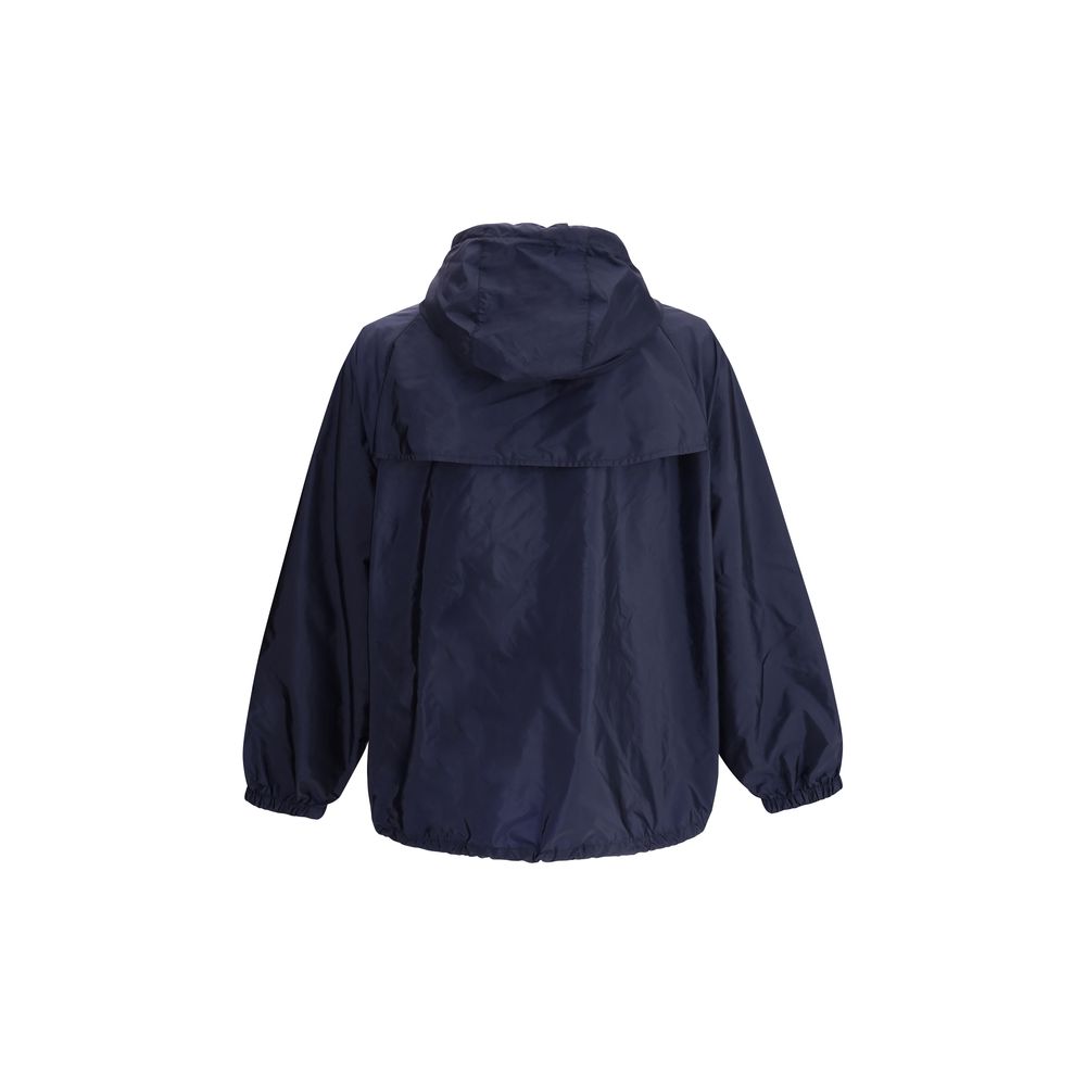 Blue Recycled Polyamide Shell JacketPrada’s Re-Nylon Jacket is a functional and refined garment designed for modern, sustainable elegance. Featuring an adjustable hood with drawstring and front closure with a double-slider zipper, it has two side welt poc