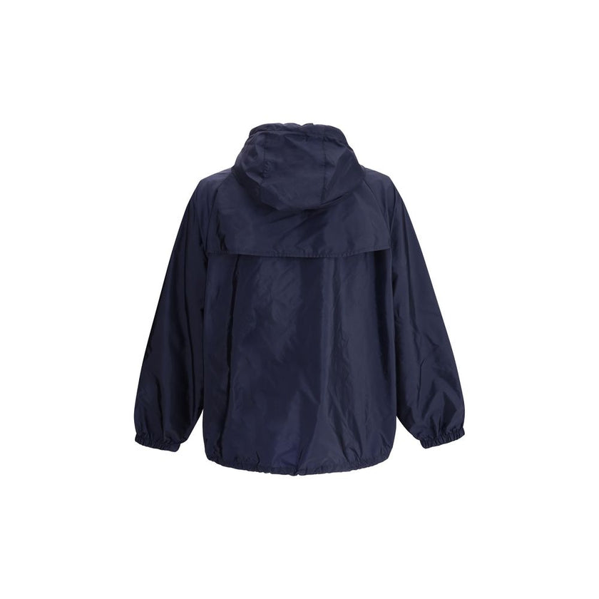 Blue Recycled Polyamide Shell JacketPrada’s Re-Nylon Jacket is a functional and refined garment designed for modern, sustainable elegance. Featuring an adjustable hood with drawstring and front closure with a double-slider zipper, it has two side welt poc