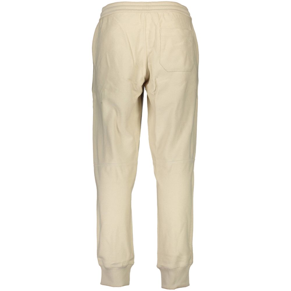 Beige Cotton Pantsports trousers, elastic waist with laces, elastic at the ankle, 3 pockets, embroidery, contrasting details, logoBeige Cotton Pant${tagsCalvin KleinAulae Beige Cotton Pant Calvin KleinAulae Beige Cotton Pant sports trousers, elastic waist