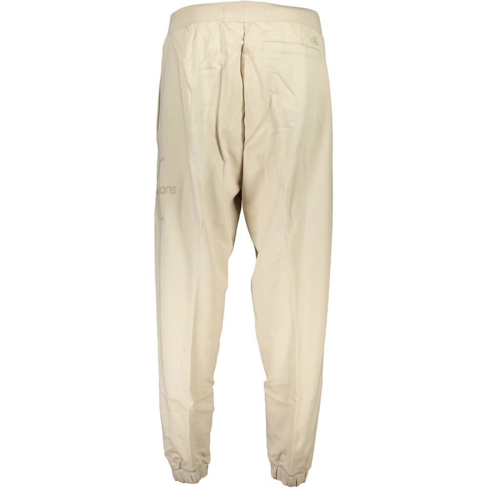 Beige Cotton Pantsports trousers, 3 pockets, elastic waist, elastic at the ankle, embroidery, logo, 50% transitional cottonBeige Cotton Pant${tagsCalvin KleinAulae Beige Cotton Pant Calvin KleinAulae Beige Cotton Pant sports trousers, 3 pockets, elastic w