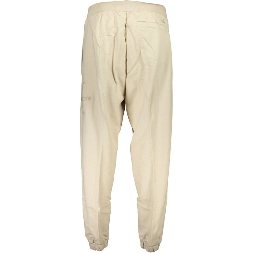Beige Cotton Pantsports trousers, 3 pockets, elastic waist, elastic at the ankle, embroidery, logo, 50% transitional cottonBeige Cotton Pant${tagsCalvin KleinAulae Beige Cotton Pant Calvin KleinAulae Beige Cotton Pant sports trousers, 3 pockets, elastic w