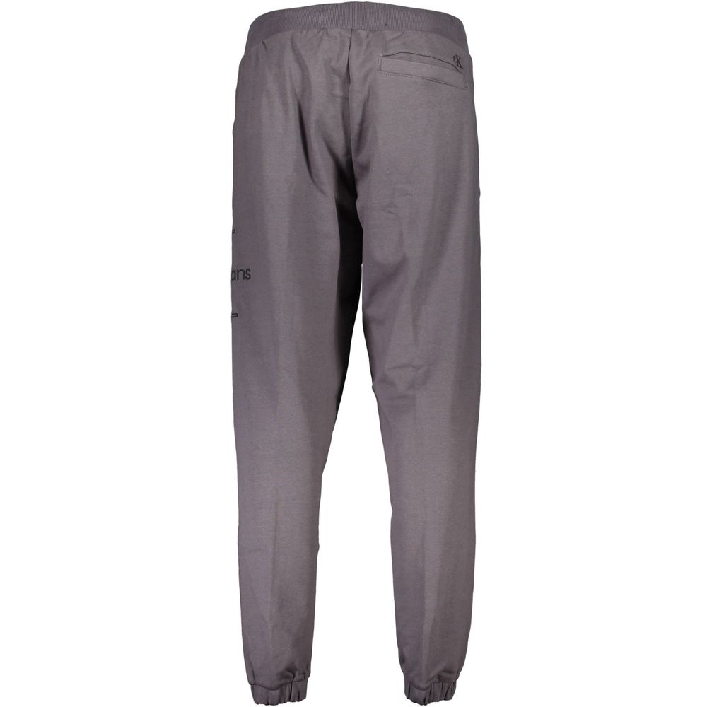Gray Cotton Pantsports trousers, 3 pockets, elastic waist, elastic at the ankle, embroidery, logo, 50% transitional cottonGray Cotton Pant${tagsCalvin KleinAulae Gray Cotton Pant Calvin KleinAulae Gray Cotton Pant sports trousers, 3 pockets, elastic waist