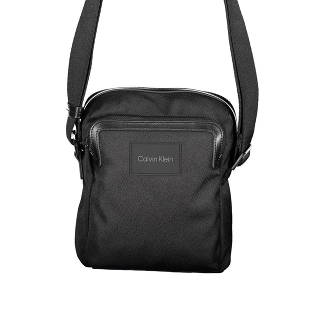 Black Polyester HandbagADJUSTABLE SHOULDER STRAP, 2 EXTERNAL POCKETS, 1 INTERNAL COMPARTMENT FOR I-PAD HOLDER, ZIP CLOSURE, LOGO, 95% POLYESTER RECYCLEDBlack Polyester Handbag${tagsCalvin KleinAulae Black Polyester Handbag Calvin KleinAulae Black Polyeste
