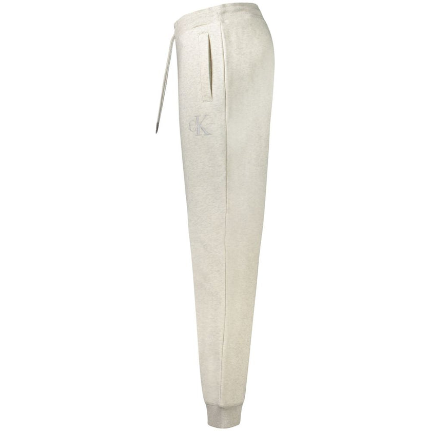 Gray Cotton PantSPORTS TROUSERS, FLEECE, ELASTIC WAIST WITH LACES, 2 POCKETS, ANKLE CUFFS, EMBROIDERY, LOGO, 20% RECYCLED COTTONGray Cotton Pant${tagsCalvin KleinAulae Gray Cotton Pant Calvin KleinAulae Gray Cotton Pant SPORTS TROUSERS, FLEECE, ELASTIC WA