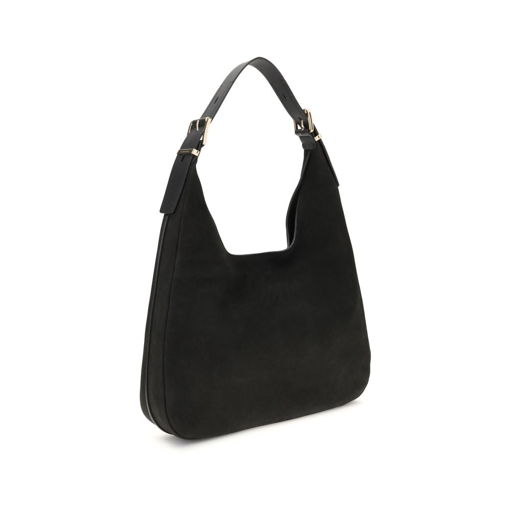 Black Calf Leather Bos Taurus Shoulder BagThe Nolita large Nubuck Shoulder Bag by Michael Kors combines a casual and sophisticated look, thanks to the soft texture of the nubuck and the textured edges that elegantly define its shape. Featuring an adjustab