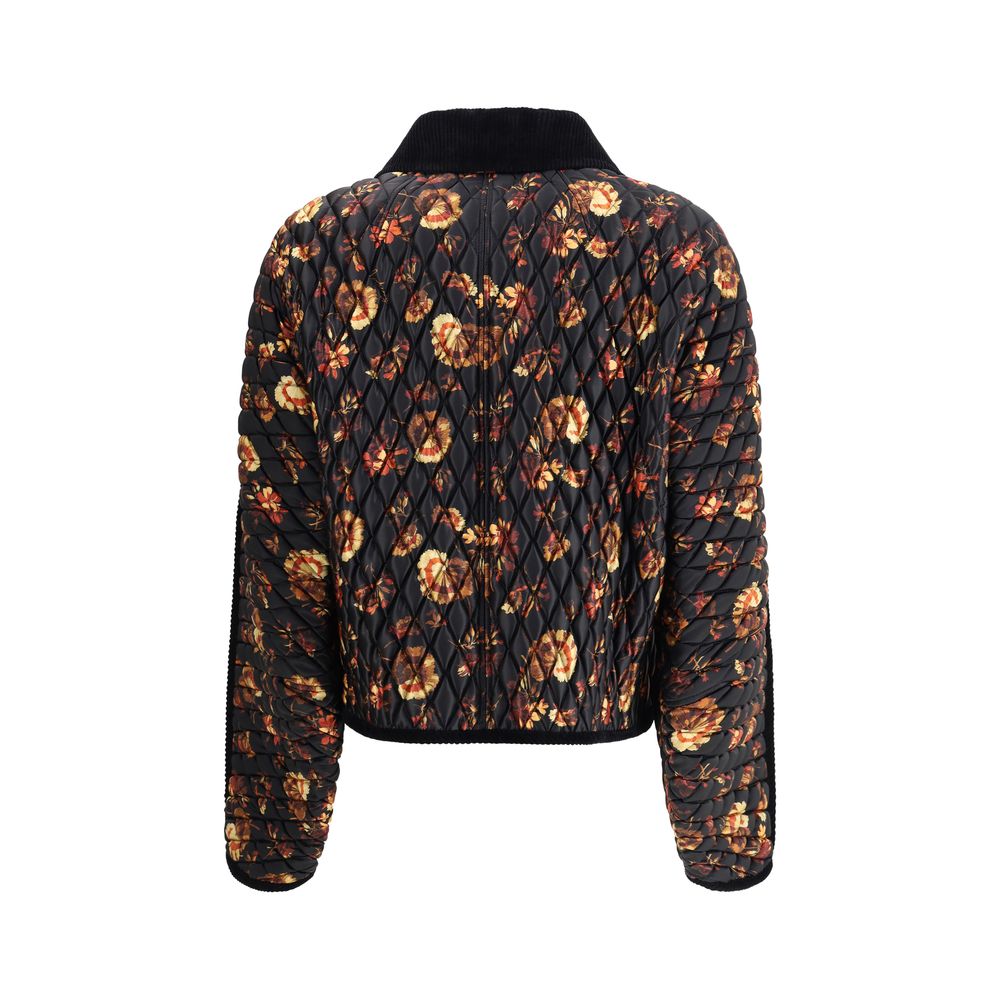 Black Polyamide ClothingThe Floriston Quilted Jacket by Burberry reimagines a British classic with a boxy silhouette in glossy nylon and contrasting corduroy trims. The geranium print, inspired by the Edwardian era, pays tribute to the English garden. Pre