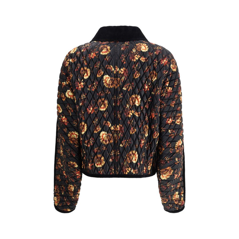 Black Polyamide ClothingThe Floriston Quilted Jacket by Burberry reimagines a British classic with a boxy silhouette in glossy nylon and contrasting corduroy trims. The geranium print, inspired by the Edwardian era, pays tribute to the English garden. Pre