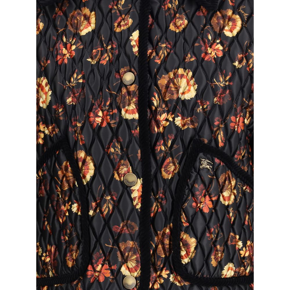 Black Polyamide ClothingThe Floriston Quilted Jacket by Burberry reimagines a British classic with a boxy silhouette in glossy nylon and contrasting corduroy trims. The geranium print, inspired by the Edwardian era, pays tribute to the English garden. Pre
