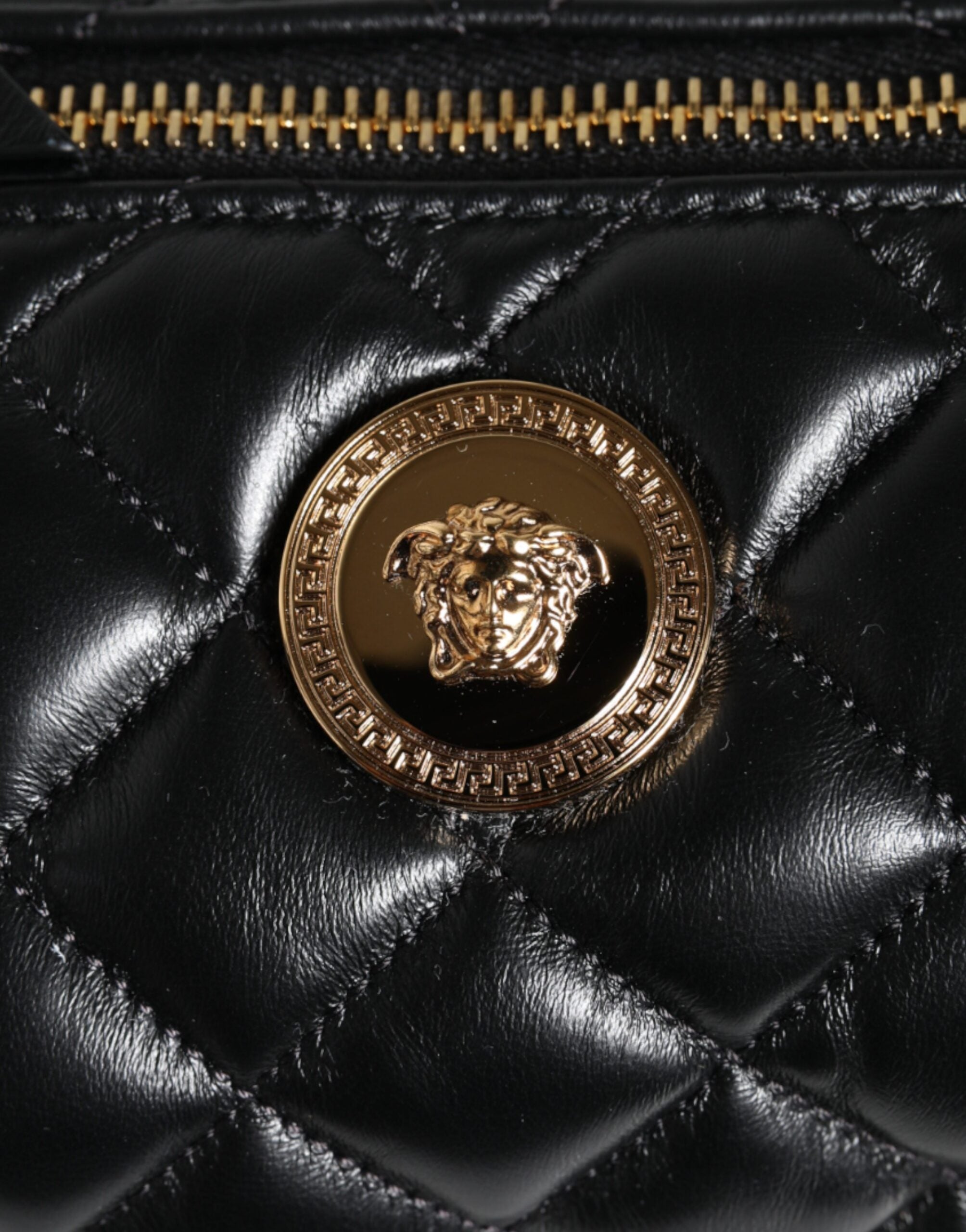 Black Mini Quilted Lambskin Leather Crossbody Sling Borse BagVERSACE Absolutely stunning, 100% Authentic brand new Versace bag. Brand logo, solid color, crossbody strap, and zipper fastening.Model: Crossbody bagColor: BlackMaterial: AOS 100%, 60% Cotton,