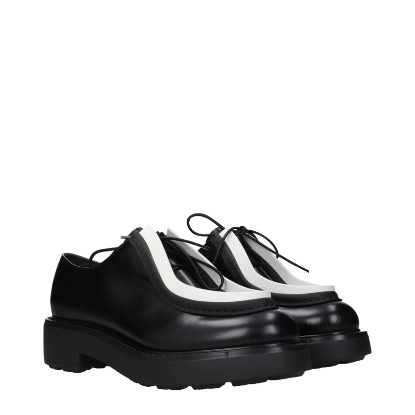 Black Leather Oxfords And DerbiesDescription: The product with MPN 1E280N055050F0967 and code F84747 leather in black is a lace up and monkstrap designed by Prada. It has features like side logo.Black Leather Oxfords And Derbies${tagsPradaAulae Black Leat