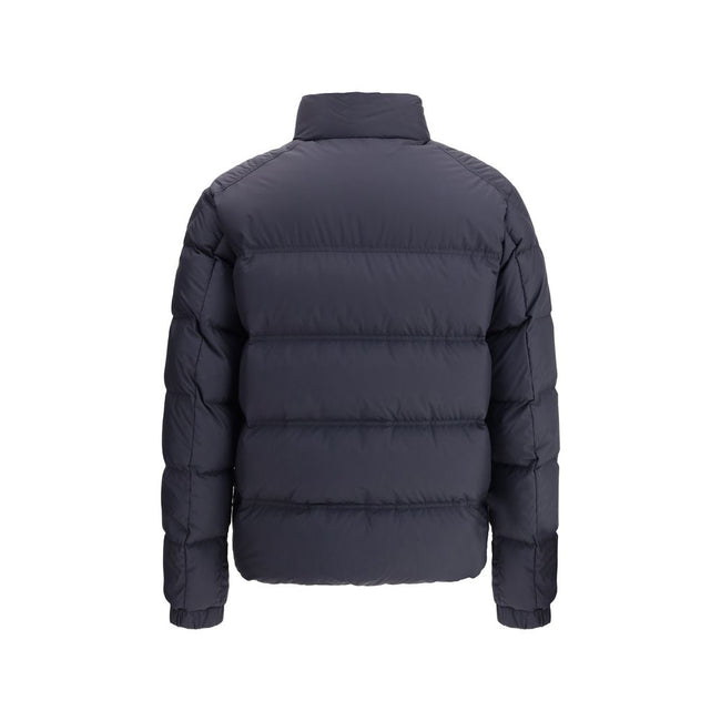 Bouvaque Down JacketBouvaque Down Jacket by Moncler combines sporty style and iconic details. Featuring an essential design, it features the logo patch on the left sleeve, zipper closure, two side welt pockets and elastic cuffs. The standing collar offers