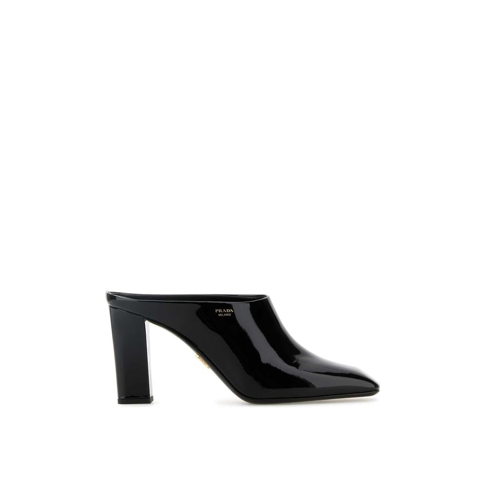 Black Calfskin MulesDescription: – Composition: 100% calf leather – Inner: Leather – Insole: Leather – Sole: Leather – Patent effect – Square toe – Branded insole – Side logo detail – Open back – Heel 8,5 cm – Made in Italy – Gender: WOMEN –Black Calfskin