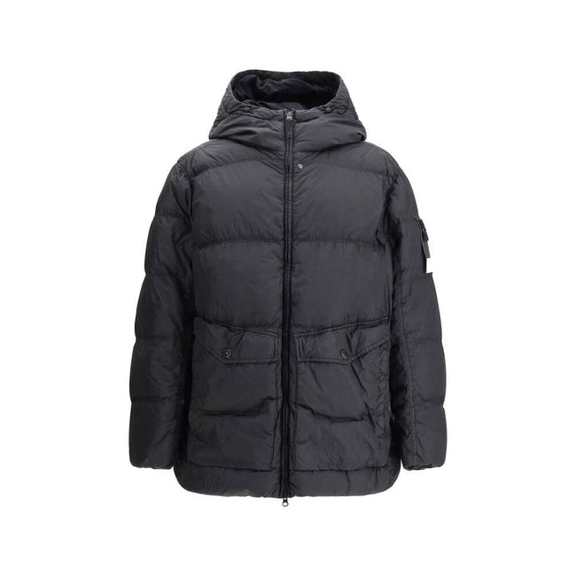 Hooded Down JacketStone Island’s hooded Down Jacket combines functionality with distinctive technical style. The padded hood is adjustable via drawstring for a perfect fit, while the two exterior pockets offer practical solutions: one with a top opening,
