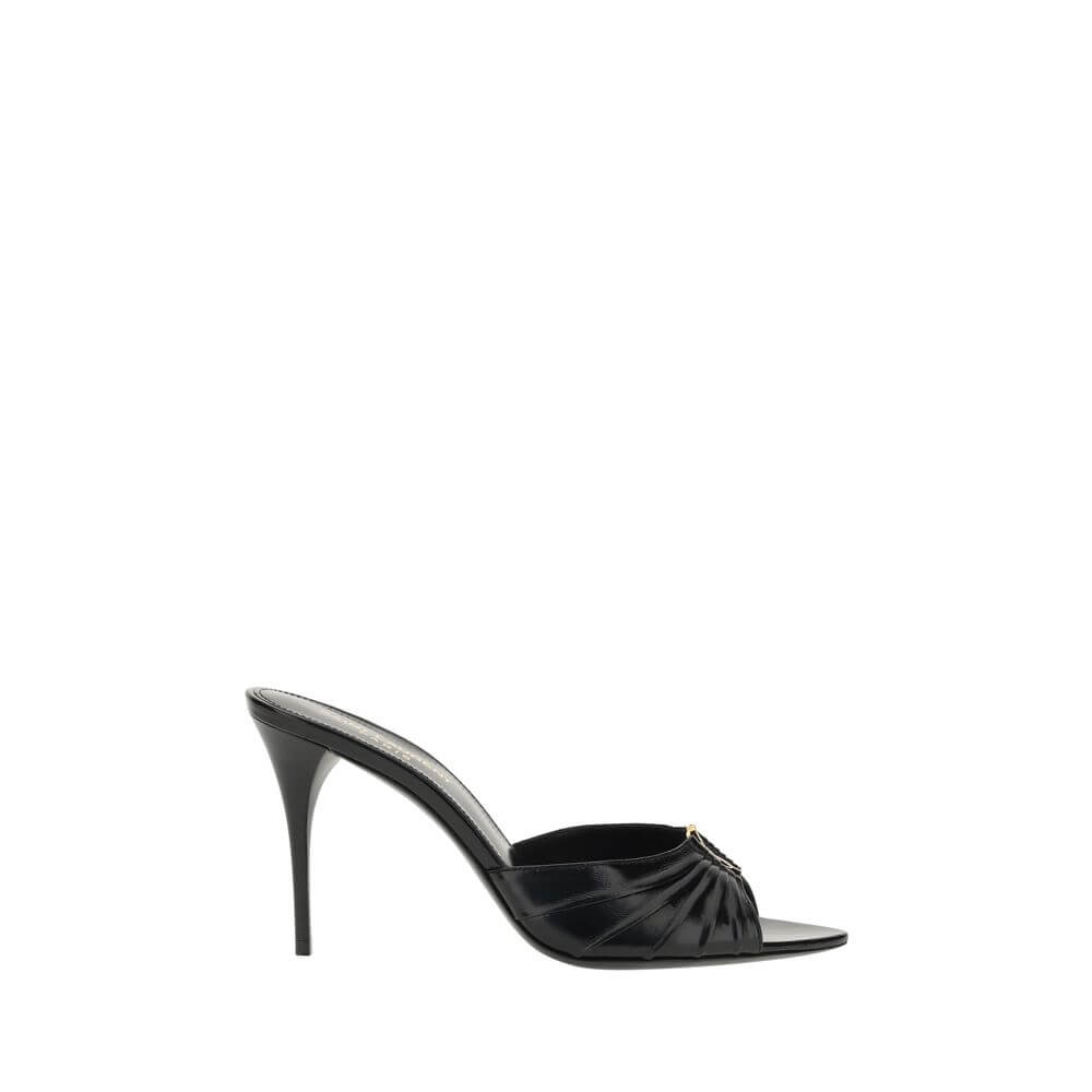 Babylone SandalsSaint Laurent’s soft lambskin Babylone Sandals are the epitome of sophisticated femininity. Featuring a refined almond toe, they stand out for the iconic YSL metallic detail applied on the front, a true symbol of the Maison’s elegance. The