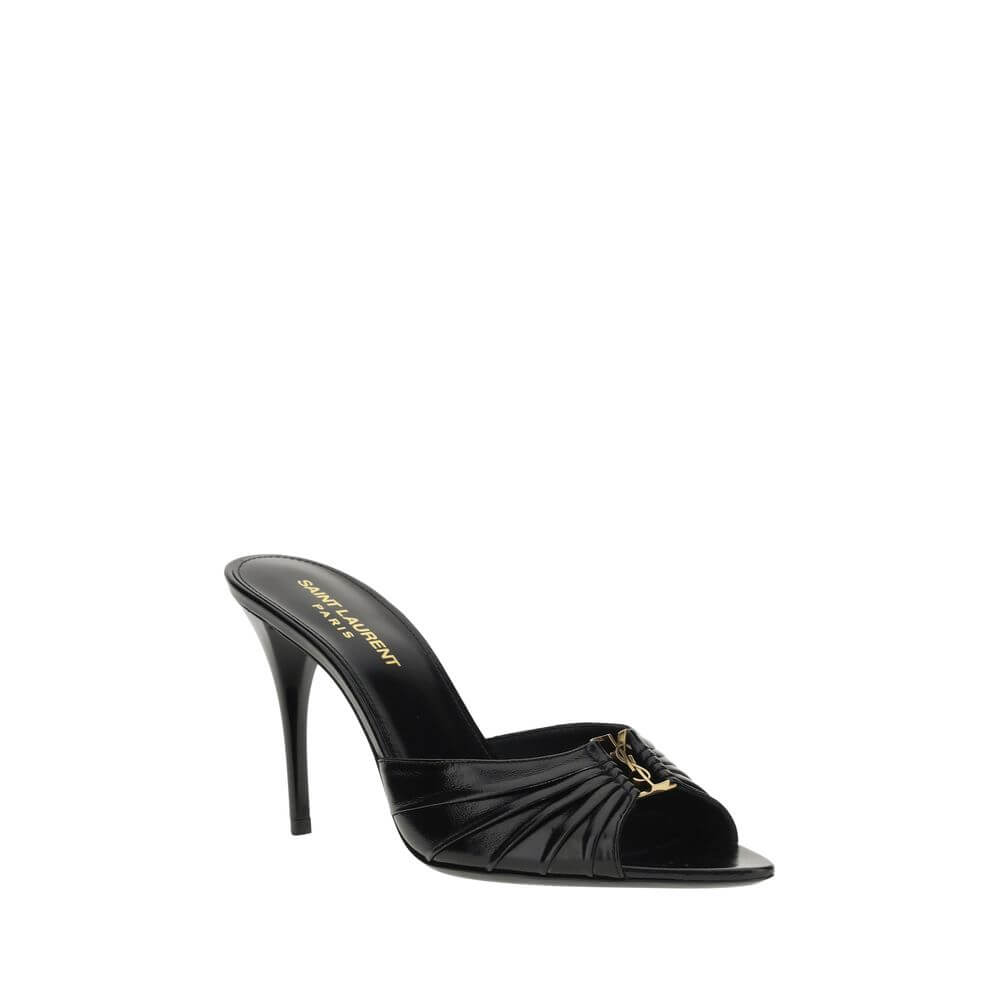 Babylone SandalsSaint Laurent’s soft lambskin Babylone Sandals are the epitome of sophisticated femininity. Featuring a refined almond toe, they stand out for the iconic YSL metallic detail applied on the front, a true symbol of the Maison’s elegance. The