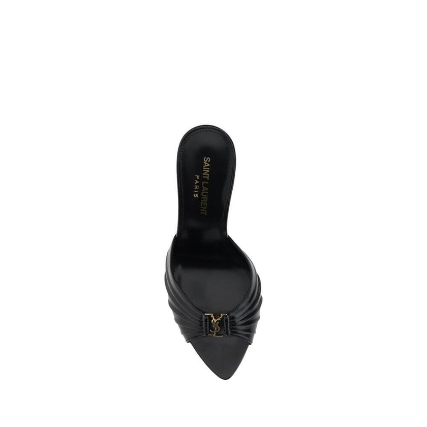 Babylone SandalsSaint Laurent’s soft lambskin Babylone Sandals are the epitome of sophisticated femininity. Featuring a refined almond toe, they stand out for the iconic YSL metallic detail applied on the front, a true symbol of the Maison’s elegance. The