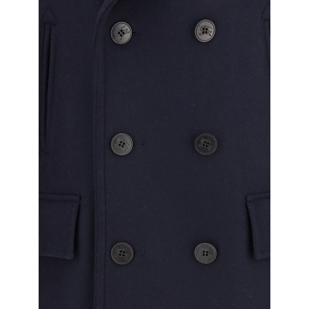 Blue Wool CoatThe Wool Pea Coat by Burberry is crafted in wool with a regular fit and tonal check lining. Its double-breasted design is enhanced by a wool-cotton undercollar woven with the iconic Burberry Check and buttons debossed with the Equestrian Kni