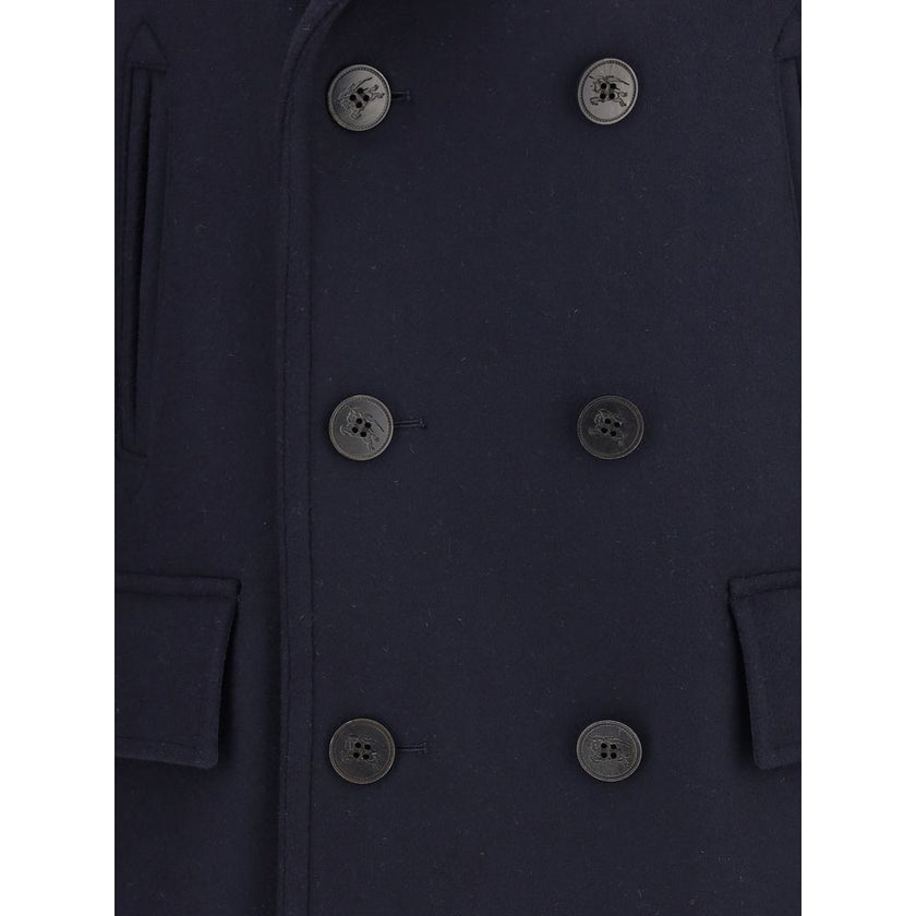 Blue Wool CoatThe Wool Pea Coat by Burberry is crafted in wool with a regular fit and tonal check lining. Its double-breasted design is enhanced by a wool-cotton undercollar woven with the iconic Burberry Check and buttons debossed with the Equestrian Kni