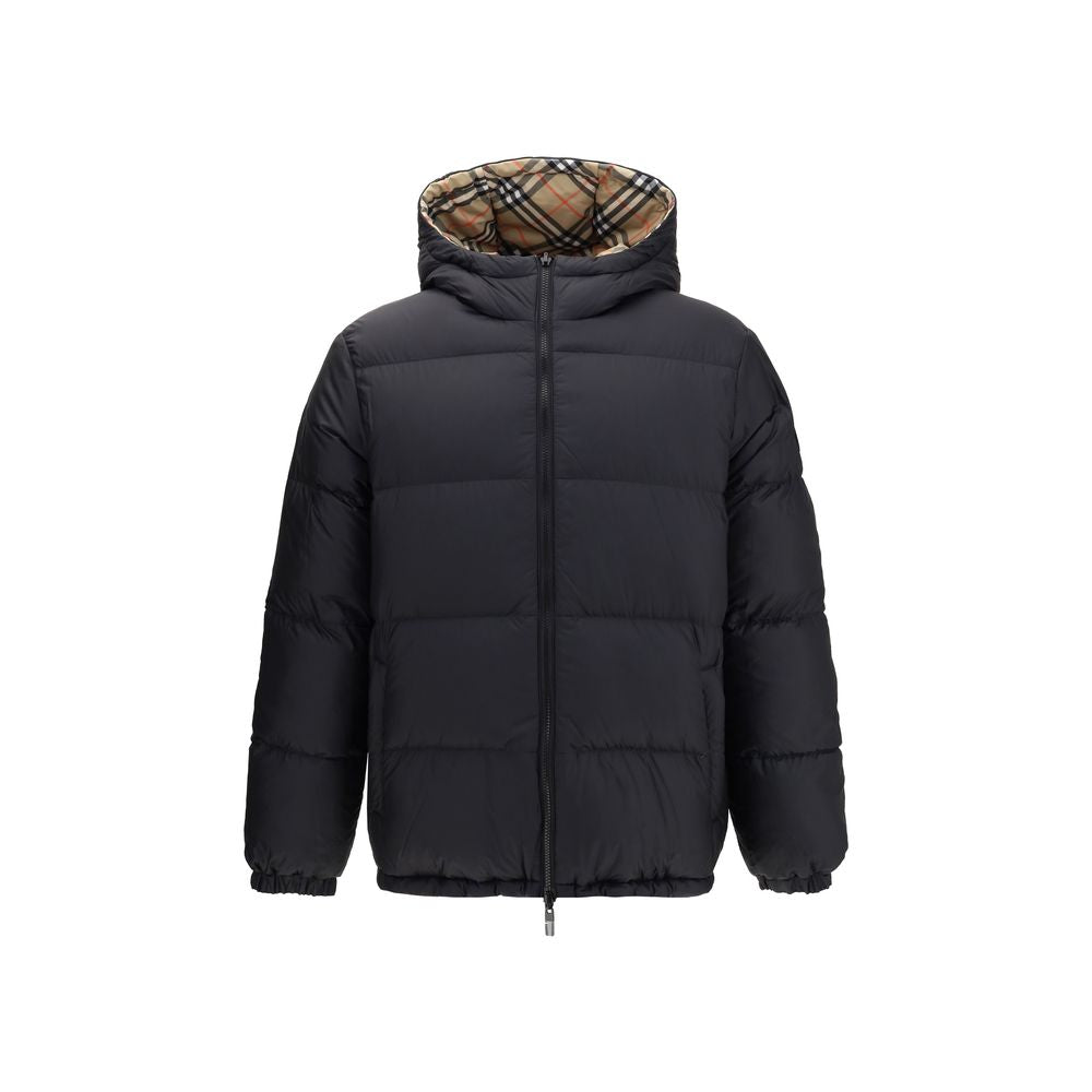 Black Polyester CoatThe Detachable Sleeve Puffer Jacket by Burberry blends versatility with heritage. Filled with goose down and insulating fibres, the design features detachable sleeves that transform it from a jacket into a gilet. Cut to a relaxed fit,