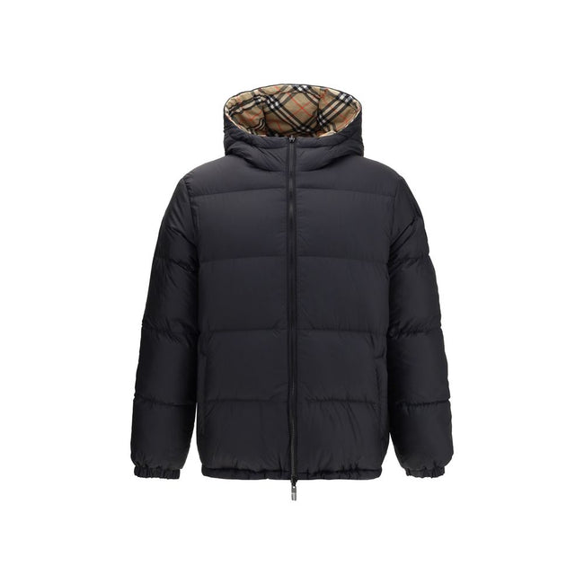 Black Polyester CoatThe Detachable Sleeve Puffer Jacket by Burberry blends versatility with heritage. Filled with goose down and insulating fibres, the design features detachable sleeves that transform it from a jacket into a gilet. Cut to a relaxed fit,