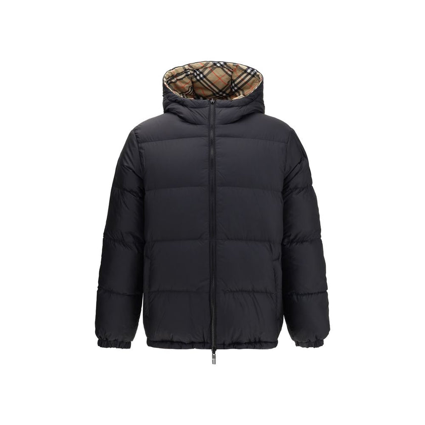 Black Polyester CoatThe Detachable Sleeve Puffer Jacket by Burberry blends versatility with heritage. Filled with goose down and insulating fibres, the design features detachable sleeves that transform it from a jacket into a gilet. Cut to a relaxed fit,