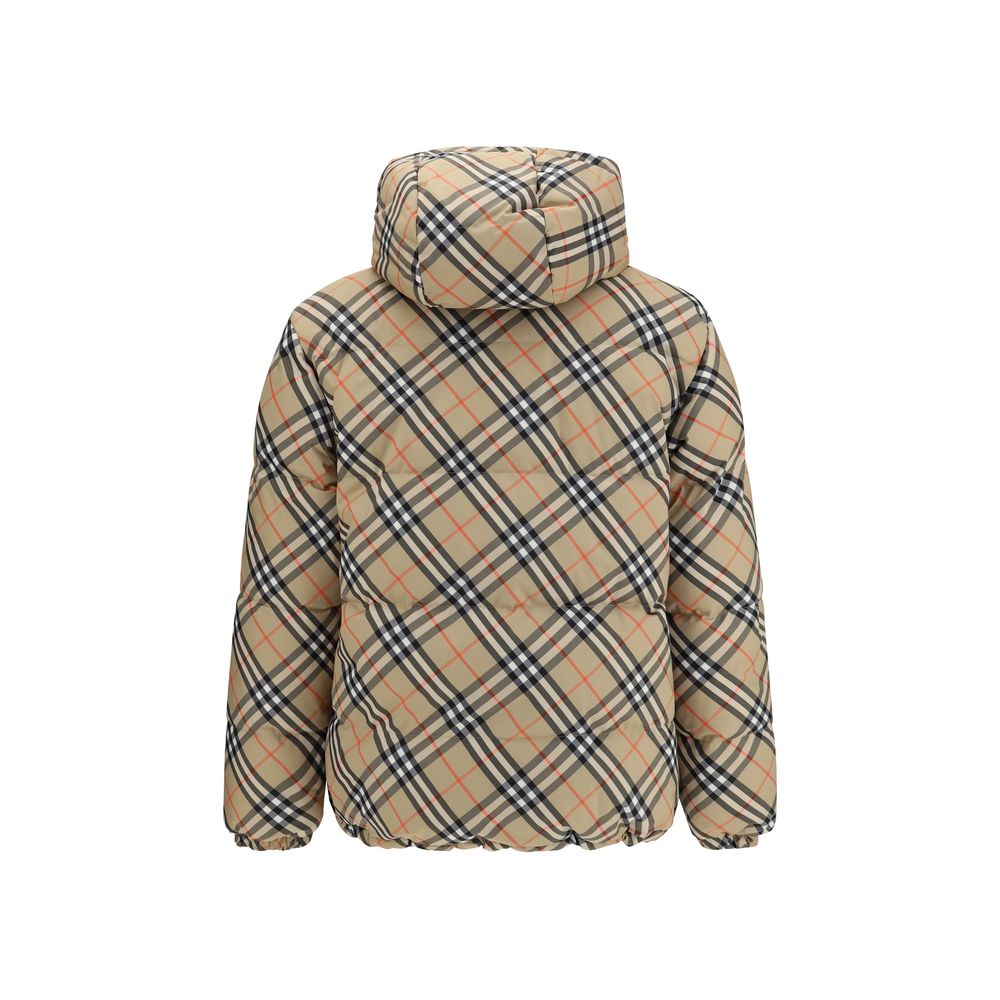 Black Polyester CoatThe Detachable Sleeve Puffer Jacket by Burberry blends versatility with heritage. Filled with goose down and insulating fibres, the design features detachable sleeves that transform it from a jacket into a gilet. Cut to a relaxed fit,