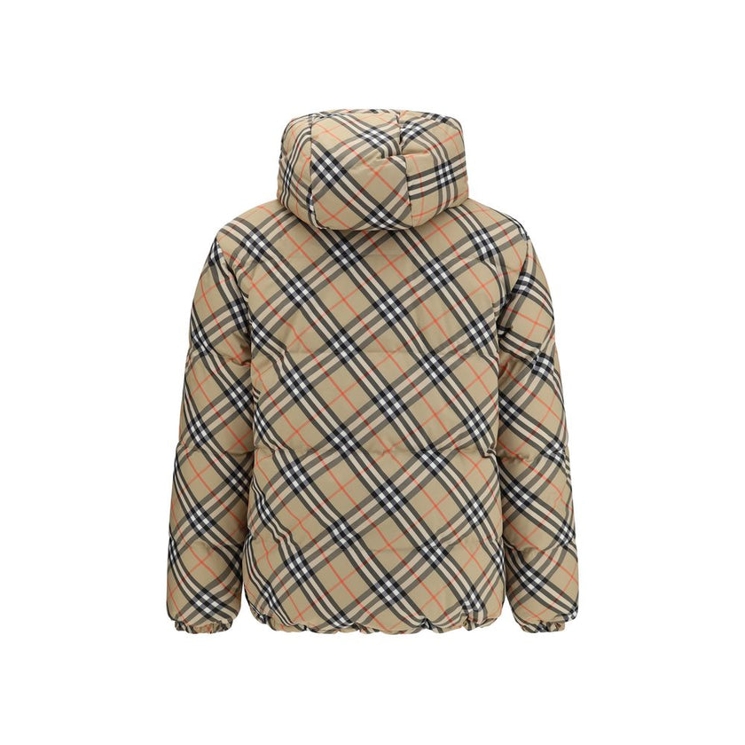 Black Polyester CoatThe Detachable Sleeve Puffer Jacket by Burberry blends versatility with heritage. Filled with goose down and insulating fibres, the design features detachable sleeves that transform it from a jacket into a gilet. Cut to a relaxed fit,