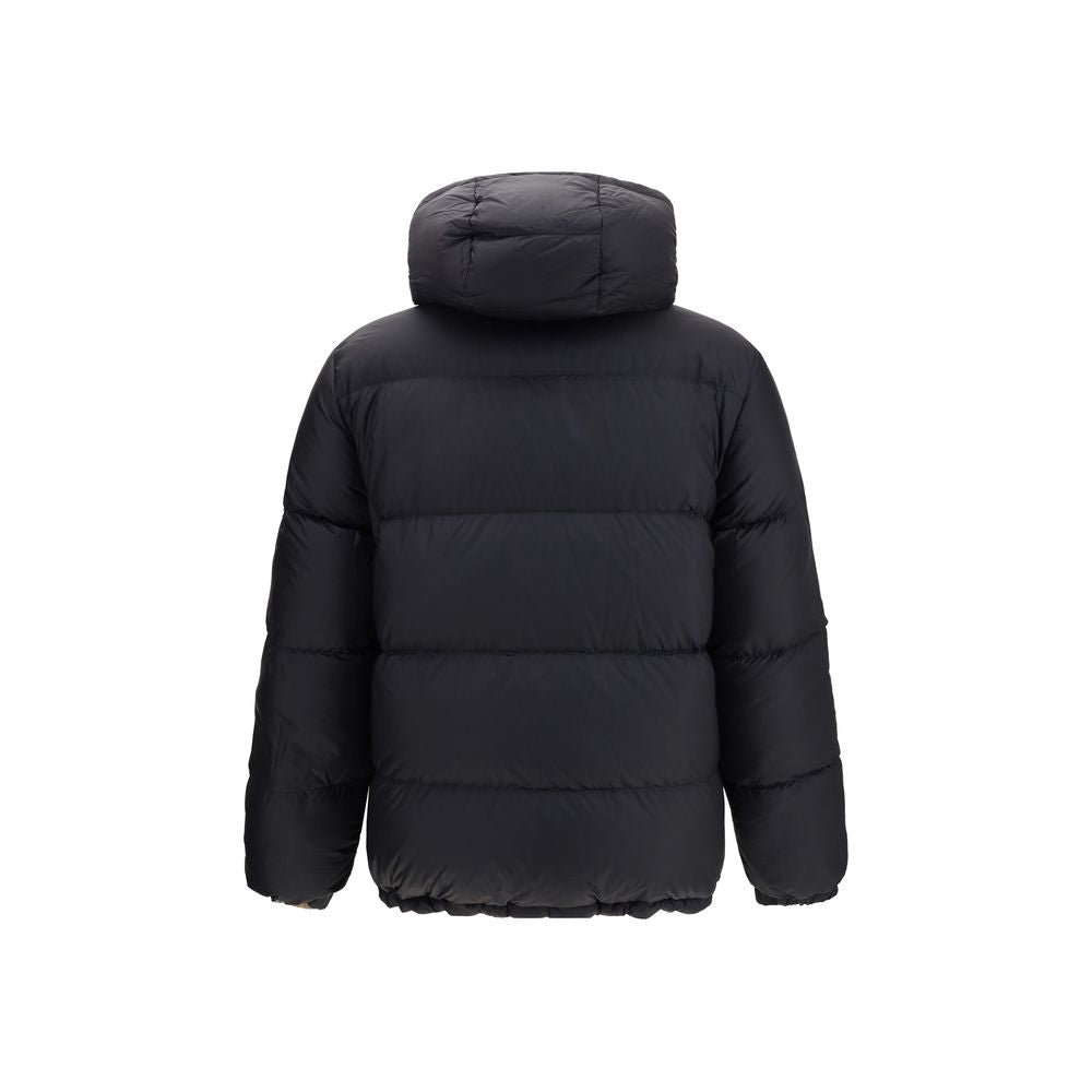 Black Polyester CoatThe Detachable Sleeve Puffer Jacket by Burberry blends versatility with heritage. Filled with goose down and insulating fibres, the design features detachable sleeves that transform it from a jacket into a gilet. Cut to a relaxed fit,