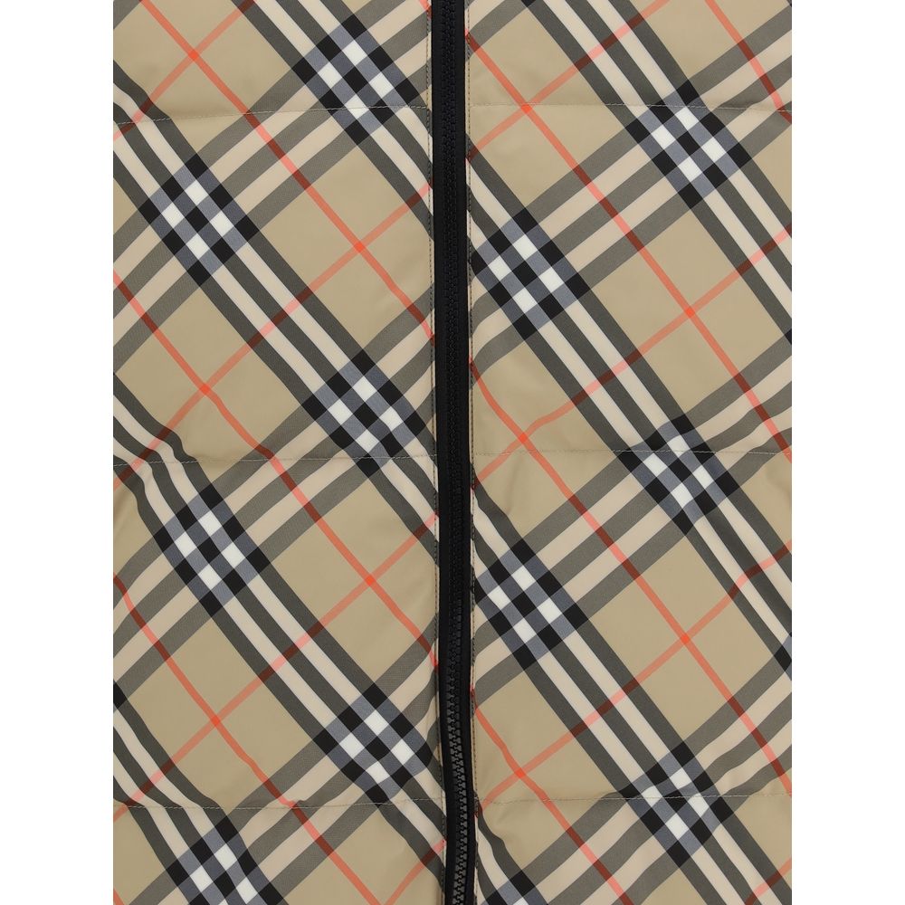 Black Polyester CoatThe Detachable Sleeve Puffer Jacket by Burberry blends versatility with heritage. Filled with goose down and insulating fibres, the design features detachable sleeves that transform it from a jacket into a gilet. Cut to a relaxed fit,