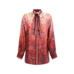 Multicolor Silk Pattern ShirtGucci’s Silk Floral Shirt is an elegant and refined piece embellished with a vibrant all-over botanical print. The collar with decorative bow, red piping and hidden buttons enhance the design, while the coordinating cuffs add