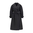 Black Polyester CoatThe Zake Trench coat from the Moncler x EE72 collection by Edward Enninful is crafted from technical 3L Polyester with Nylon laqué sleeve lining, it combines durability with comfort. The design features a button closure, welt pockets,