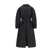 Black Polyester CoatThe Zake Trench coat from the Moncler x EE72 collection by Edward Enninful is crafted from technical 3L Polyester with Nylon laqué sleeve lining, it combines durability with comfort. The design features a button closure, welt pockets,