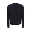 Black Viscose SweatshirtThe Sweatshirt by Moncler x EE72 by Edward Enninful reflects the futuristic style of the collection, combining clean lines with innovative materials. Crafted from Viscose and Neoprene, it features a crew neck design with long sleev