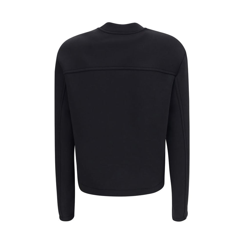Black Viscose SweatshirtThe Sweatshirt by Moncler x EE72 by Edward Enninful reflects the futuristic style of the collection, combining clean lines with innovative materials. Crafted from Viscose and Neoprene, it features a crew neck design with long sleev
