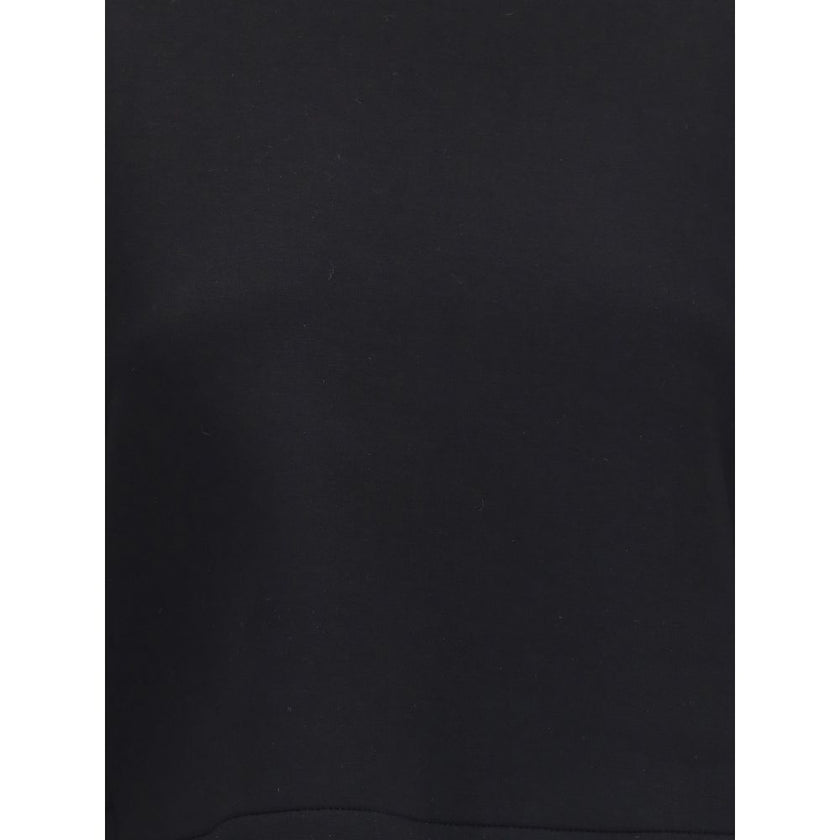 Black Viscose SweatshirtThe Sweatshirt by Moncler x EE72 by Edward Enninful reflects the futuristic style of the collection, combining clean lines with innovative materials. Crafted from Viscose and Neoprene, it features a crew neck design with long sleev