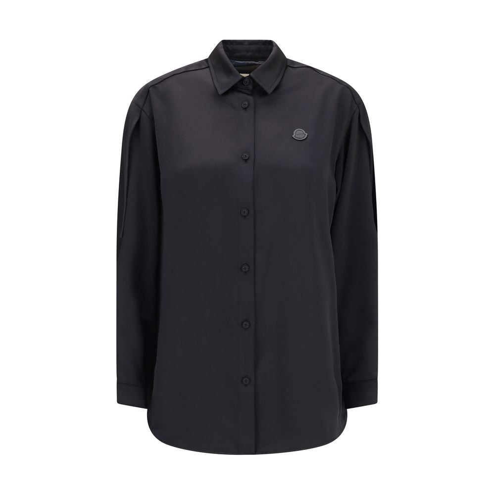 Black Polyester Dress ShirtThe Shirt in Technical Polyester Satin Moncler x EE72 collection by Edward Enninful and finished with a nylon laqué yoke lining, it features a classic shirt collar, button closure, adjustable cuffs, and a back strap with snap bu
