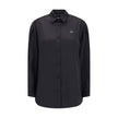Black Polyester Dress ShirtThe Shirt in Technical Polyester Satin Moncler x EE72 collection by Edward Enninful and finished with a nylon laqué yoke lining, it features a classic shirt collar, button closure, adjustable cuffs, and a back strap with snap bu