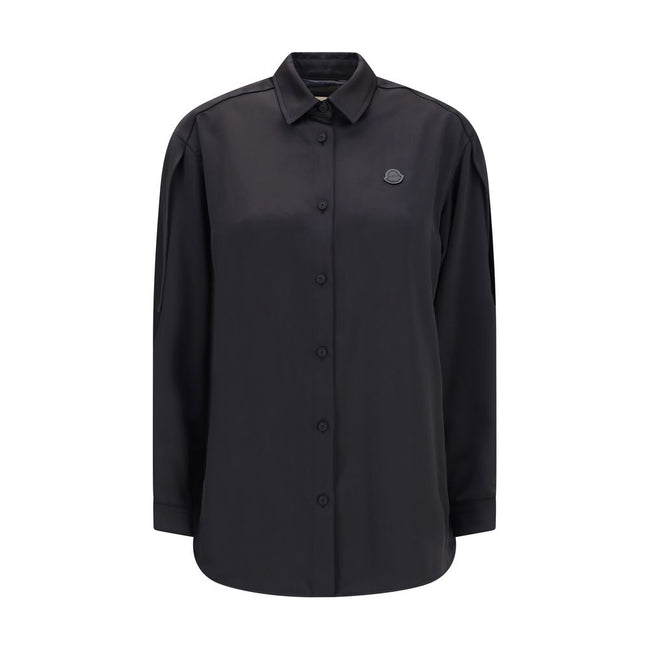 Black Polyester Dress ShirtThe Shirt in Technical Polyester Satin Moncler x EE72 collection by Edward Enninful and finished with a nylon laqué yoke lining, it features a classic shirt collar, button closure, adjustable cuffs, and a back strap with snap bu