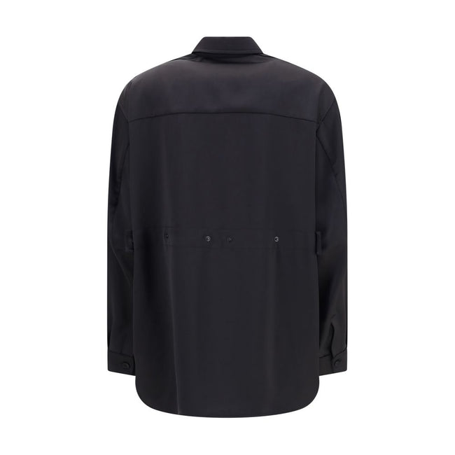 Black Polyester Dress ShirtThe Shirt in Technical Polyester Satin Moncler x EE72 collection by Edward Enninful and finished with a nylon laqué yoke lining, it features a classic shirt collar, button closure, adjustable cuffs, and a back strap with snap bu