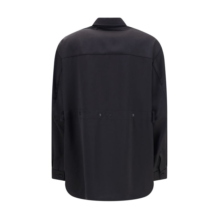 Black Polyester Dress ShirtThe Shirt in Technical Polyester Satin Moncler x EE72 collection by Edward Enninful and finished with a nylon laqué yoke lining, it features a classic shirt collar, button closure, adjustable cuffs, and a back strap with snap bu