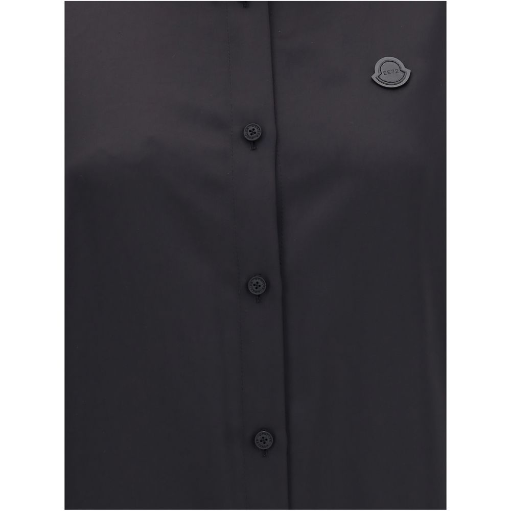 Black Polyester Dress ShirtThe Shirt in Technical Polyester Satin Moncler x EE72 collection by Edward Enninful and finished with a nylon laqué yoke lining, it features a classic shirt collar, button closure, adjustable cuffs, and a back strap with snap bu